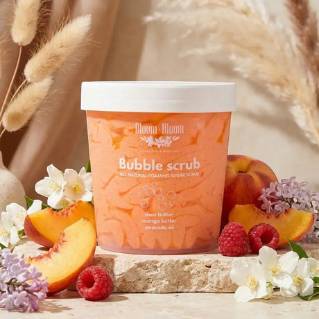 Bloom-Bloom Luxury Bath & Body treats Bubble Scrub, a 2-in-1 foaming sugar scrub with mango butter, shea butter, and avocado oil. Peach and raspberry scented.
