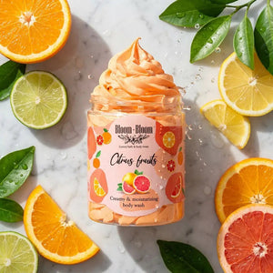 Bloom-Bloom Luxury Bath & Body treats Citrus Fruits creamy & moisturizing body wash in a jar, surrounded by fresh citrus slices.