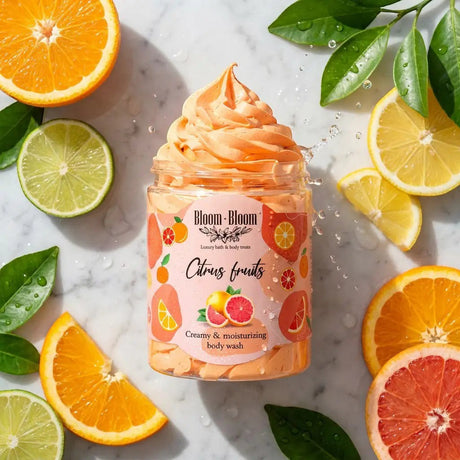 Bloom-Bloom Luxury Bath & Body treats Citrus Fruits creamy & moisturizing body wash in a jar, surrounded by fresh citrus slices.