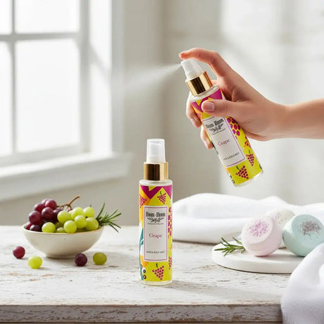 Bloom-Bloom Luxury Bath & Body treats Grape Hair & Body Mist with panthenol and aloe vera, 100ml bottle being sprayed.