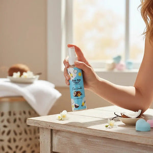 Bloom-Bloom Luxury Bath & Body treats Coco-Vanilla Hair & Body Mist with Panthenol & Aloe Vera, 100ml bottle held by hand.