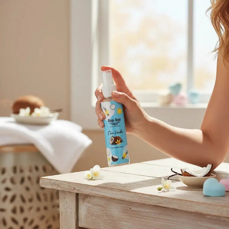 Bloom-Bloom Luxury Bath & Body treats Coco-Vanilla Hair & Body Mist with Panthenol & Aloe Vera, 100ml bottle held by hand.
