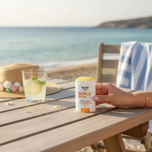 Bloom-Bloom Luxury Bath & Body treats Sun Stick SPF 50, a clear, portable sunscreen stick with Vitamin E and turmeric oil, perfect for face and body.
