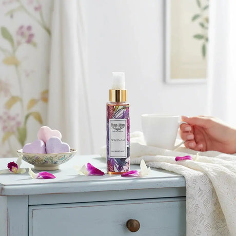 Bloom-Bloom Luxury Bath & Body treats Wild Orchid Hair & Body Mist with Panthenol & Aloe Vera, 100ml bottle with floral design.