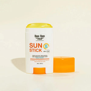Bloom-Bloom Sun Stick SPF 50, a transparent face and body sunscreen stick with Vitamin E and turmeric oil. Water-resistant and vegan.