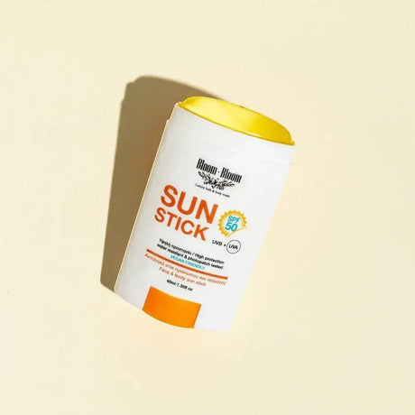 Bloom-Bloom Sun Stick SPF 50, a transparent, water-resistant face and body sunscreen stick with Vitamin E and turmeric oil.